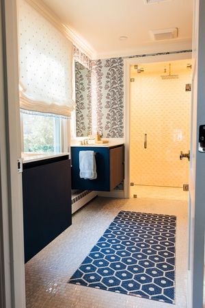 Renovated bathroom featuring double vanity and walk-in shower